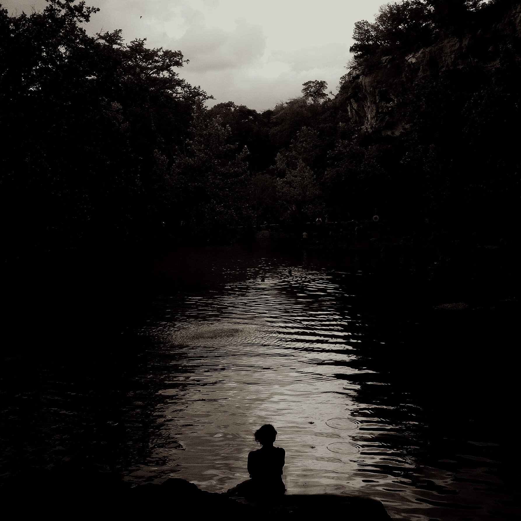 Woman sitting at the river side 